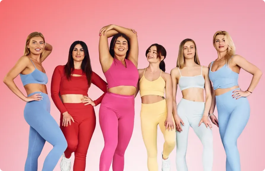 Six women in colorful athletic wear, smiling, posing against a pink gradient backdrop.