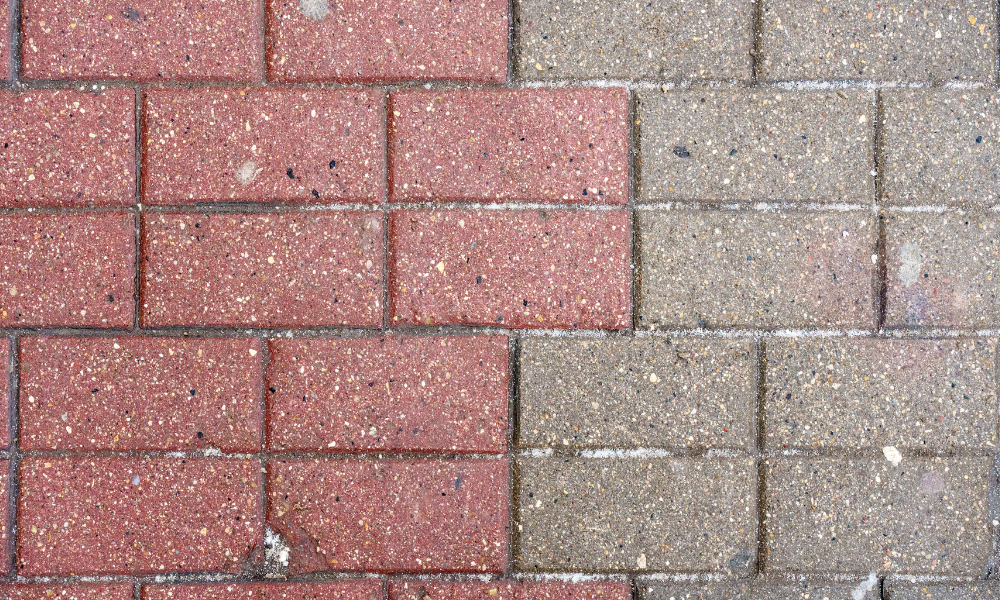 A close up of a brick pavement before and after being cleaned.
