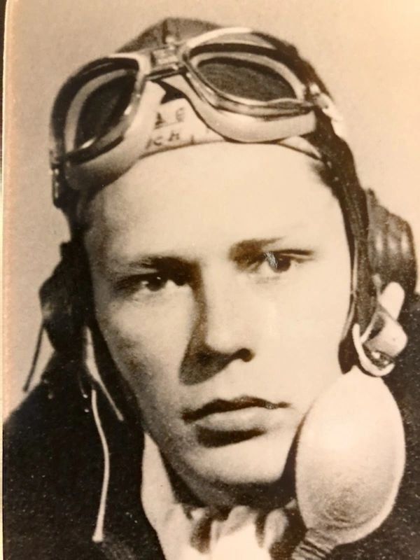 A black and white photo of a man wearing a helmet and goggles.