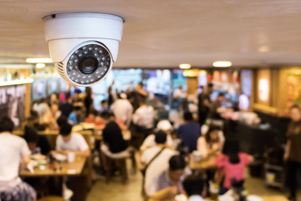 A Security Camera is Hanging From the Ceiling of a Restaurant — Coffs Coast Antenna Services in Eungai Creek, NSW