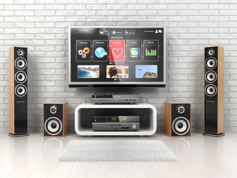 TV Mounted on Wall With Speakers — Coffs Coast Antenna Services in Nambucca Heads, NSW