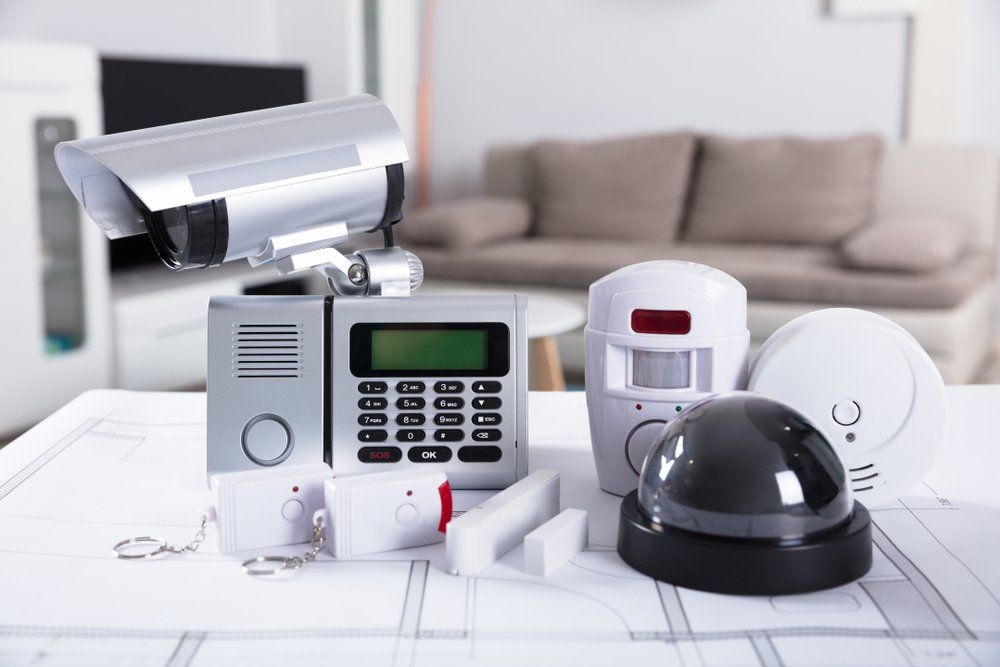 A Security System is Sitting on a Table in a Living Room — Coffs Coast Antenna Services in Eungai Creek, NSW