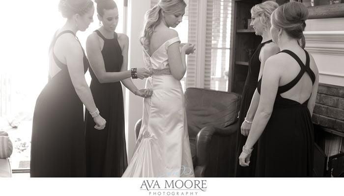 A bride is getting ready for her wedding with her bridesmaids.