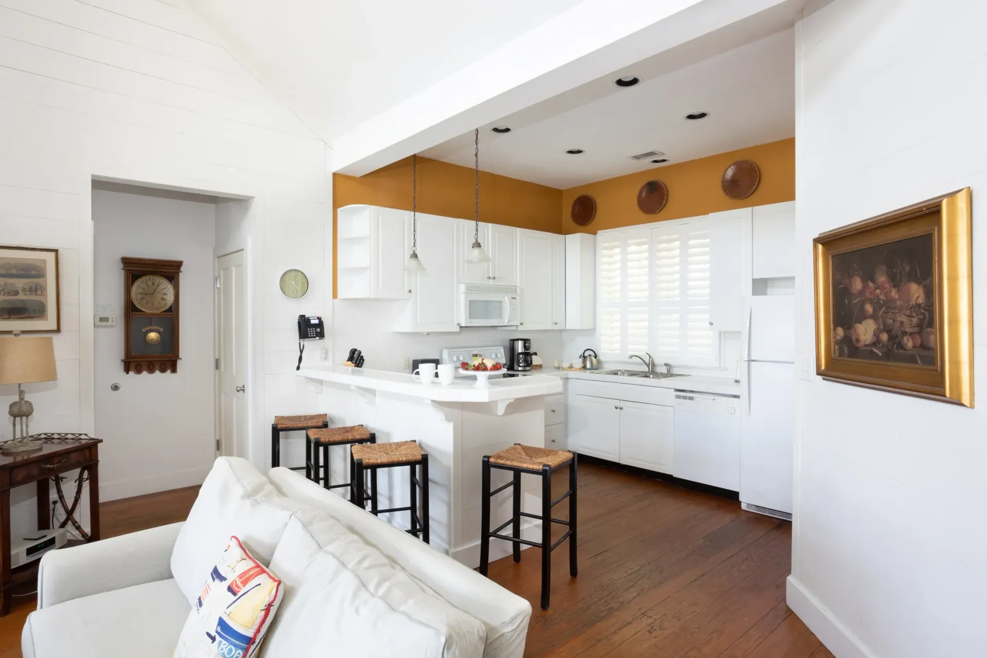 Kitchen with bar seating adjoined to the living room space