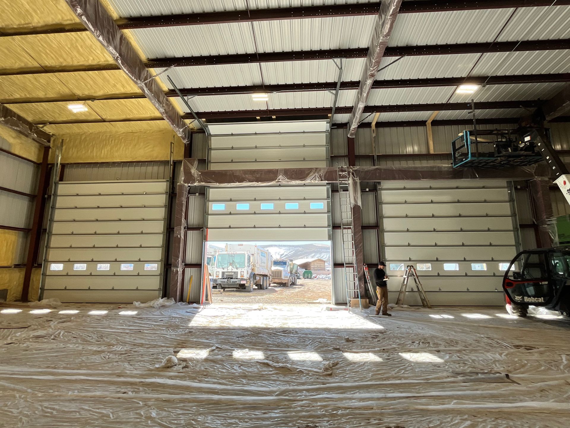 A large garage door is open in a building.