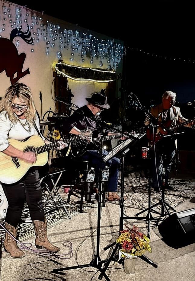 A group of people are playing instruments on a stage.