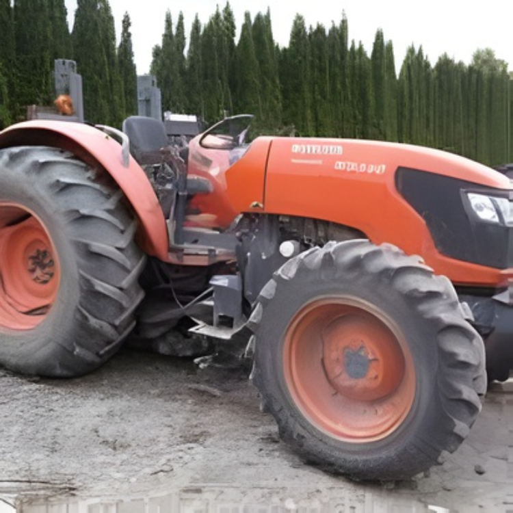 Orange Kubota M6060 tractor parked outdoors with trees in the background at REIMOLDS Nursery