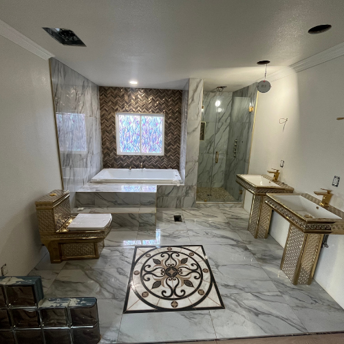 A bathroom with two sinks a toilet and a bathtub