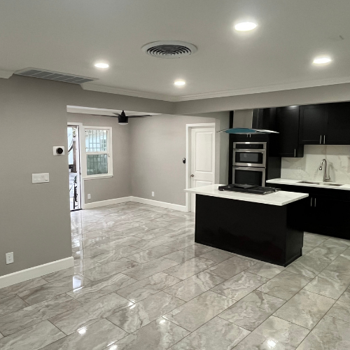 A kitchen with a large island in the middle of the room.