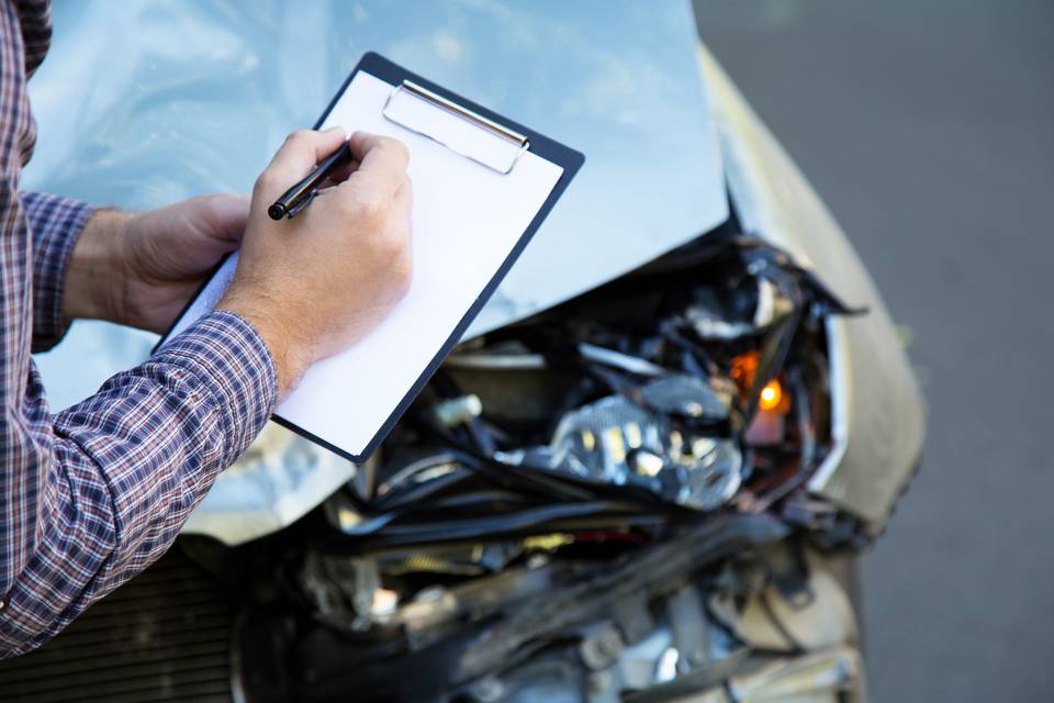 a worker checking damage assessment