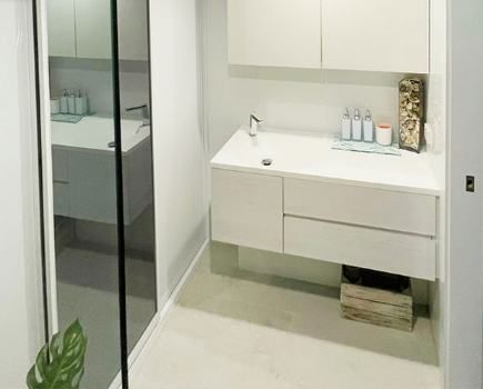 Modern White Cabinetry In The Bathroom — Nyblad Construction in Caloundra West, QLD
