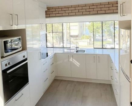 Elegant White Empty Kitchen — Nyblad Construction in Caloundra West, QLD