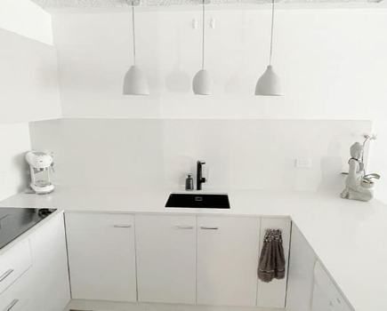 White Cabinets And Countertop Kitchen — Nyblad Construction in Caloundra West, QLD