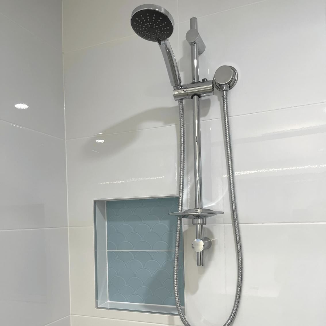 A Shower Head With A Hose Attached To It — Nyblad Construction in Caloundra West, QLD