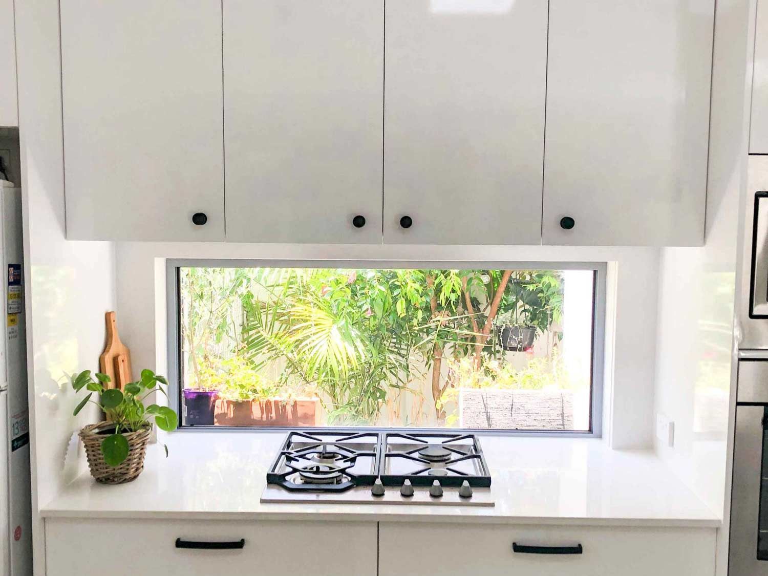 A Kitchen With A Stove — Nyblad Construction in Caloundra West, QLD