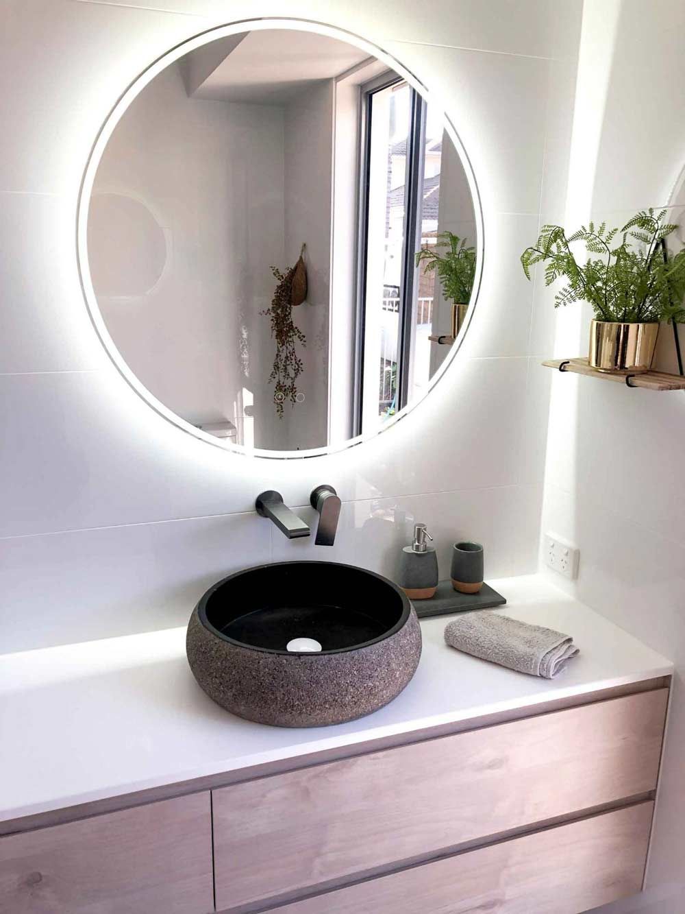 Round Mirror With Light In The Bathroom — Nyblad Construction in Caloundra West, QLD