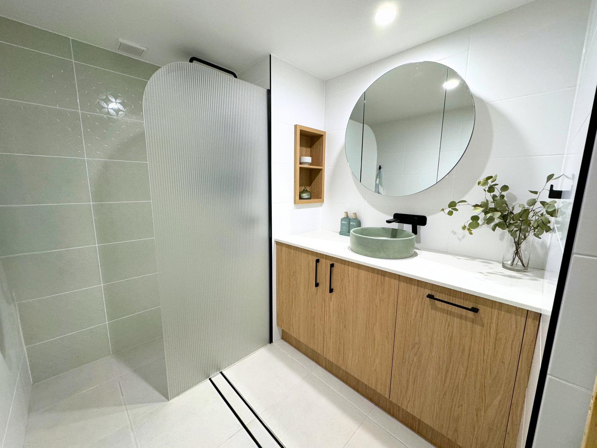 Bathroom With Wooden Cabinets — Nyblad Construction in Caloundra West, QLD