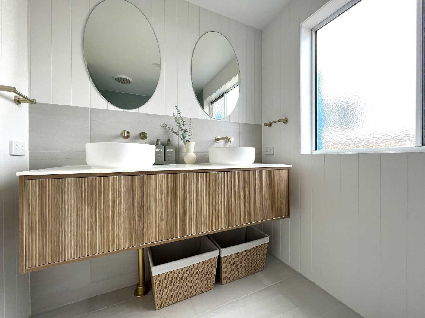 Two Round Mirrors In The Bathroom — Nyblad Construction in Caloundra West, QLD