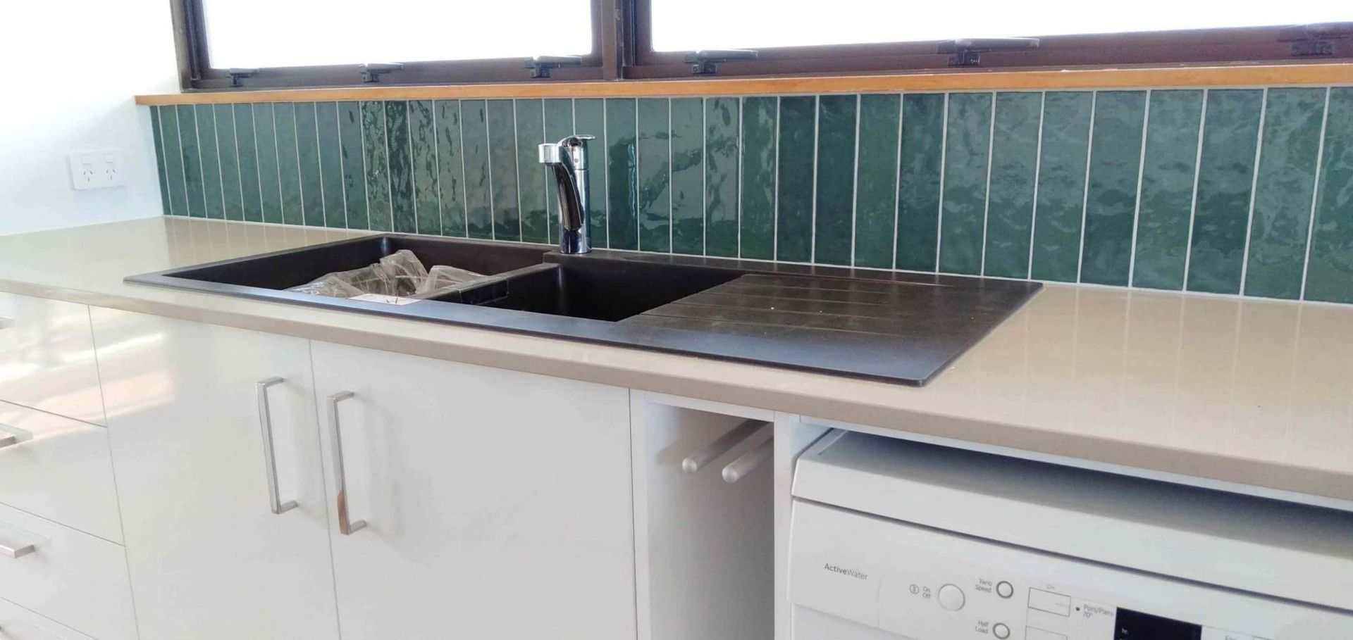 Black Steel Faucet Installation In The Kitchen — Nyblad Construction in Caloundra West, QLD