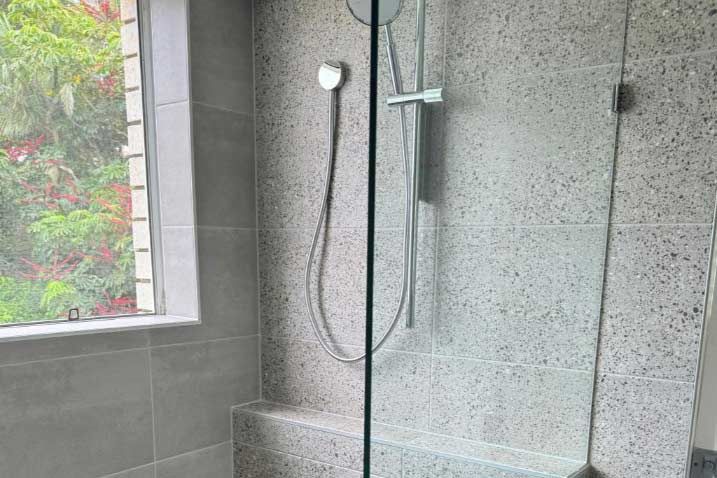 A Bathroom With A Walk In Shower Beside The Window — Nyblad Construction in Caloundra West, QLD
