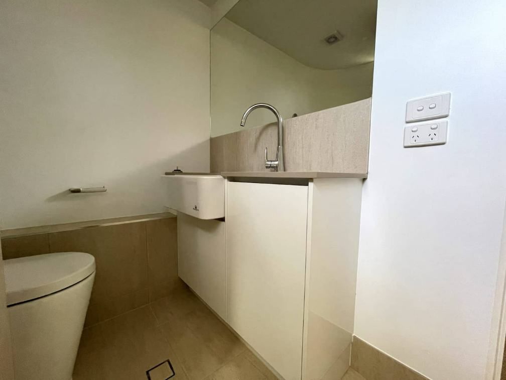 Bathroom With Toilet, Cabinets And Sink — Nyblad Construction in Caloundra West, QLD