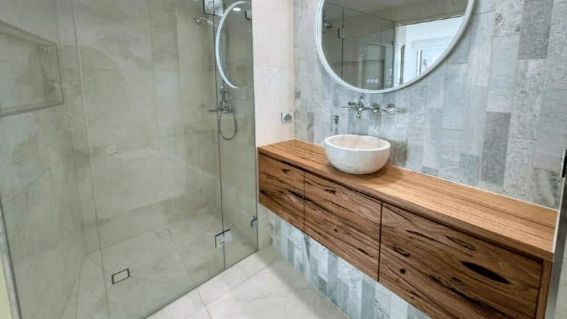 Bathroom With Wooden Drawer And Sink — Nyblad Construction in Caloundra West, QLD