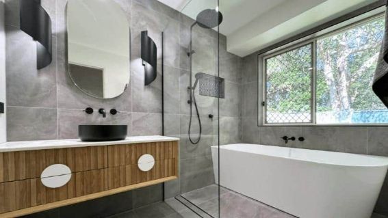 Floating Wooden Cabinet And Two Bathroom Sinks And Large Mirror Side View — Nyblad Construction in Caloundra West, QLD