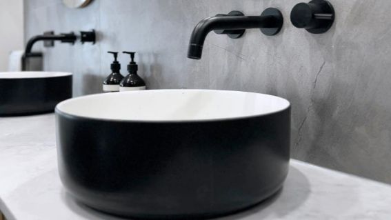 A Black And White Vanity Sink Is Sitting On A Counter In A Bathroom — Nyblad Construction in Caloundra West, QLD