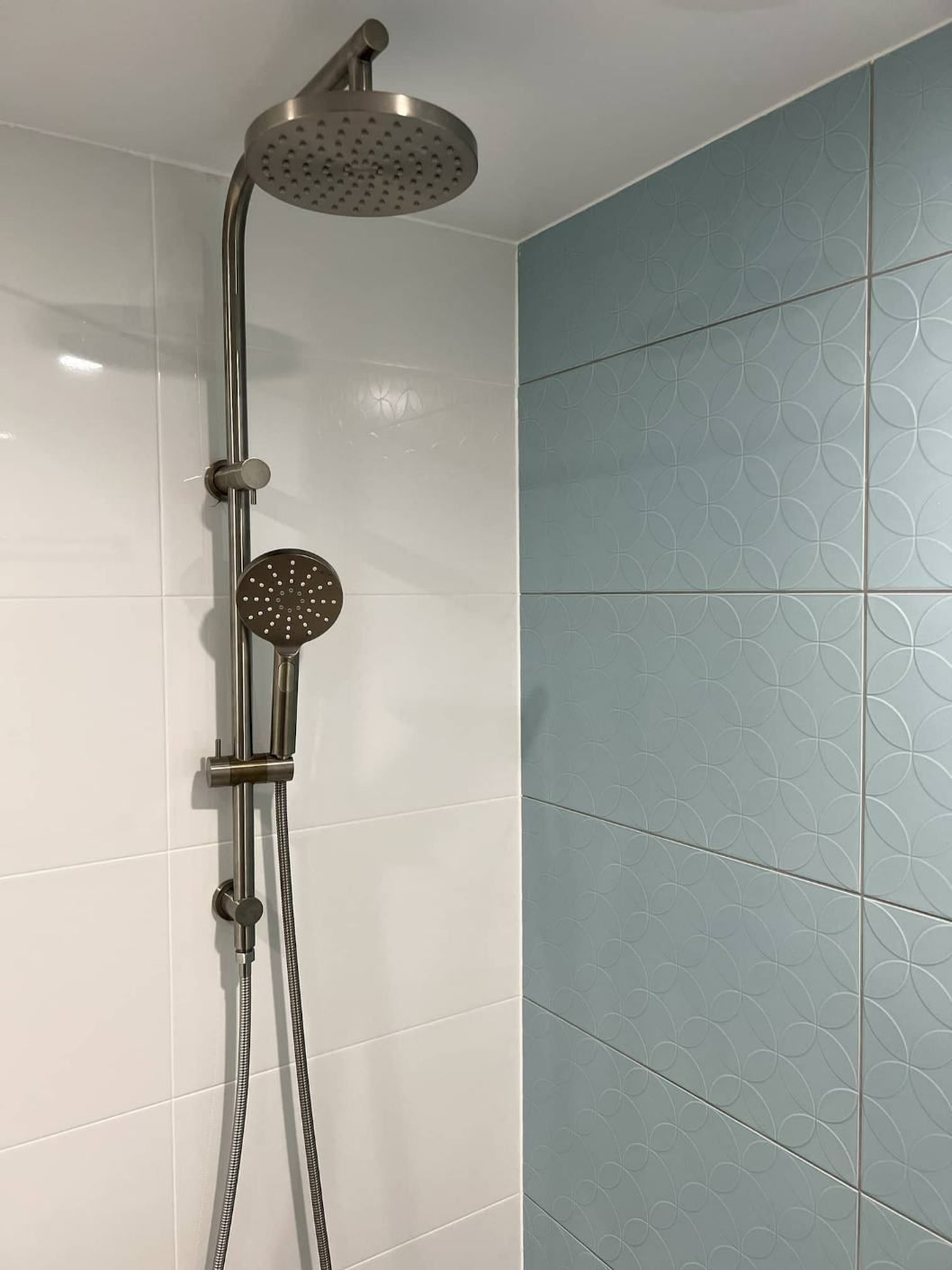The Shower Head Is Positioned From The Ceiling In The Bathroom — Nyblad Construction in Caloundra West, QLD