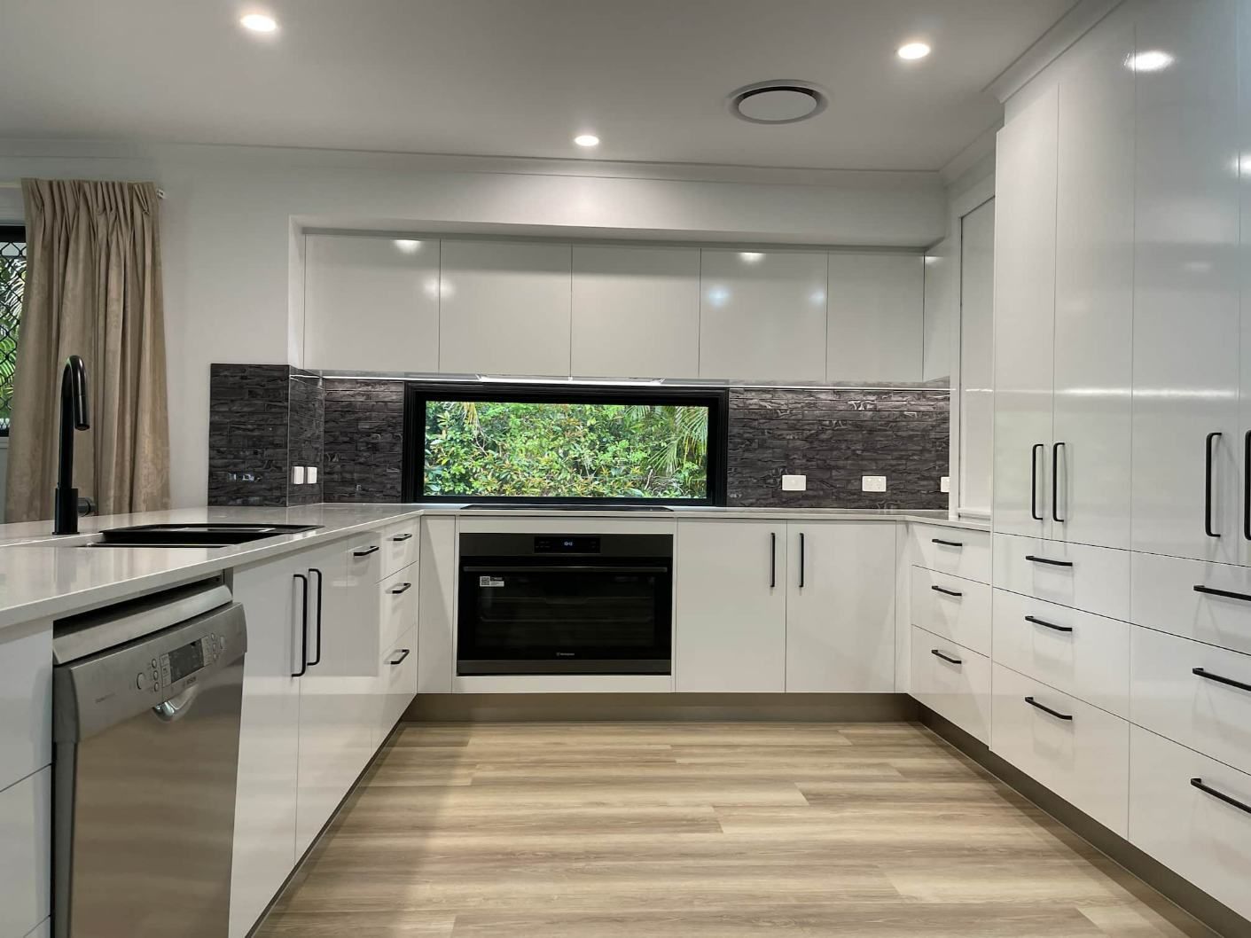 Large Kitchen With White Cabinets — Nyblad Construction in Caloundra West, QLD