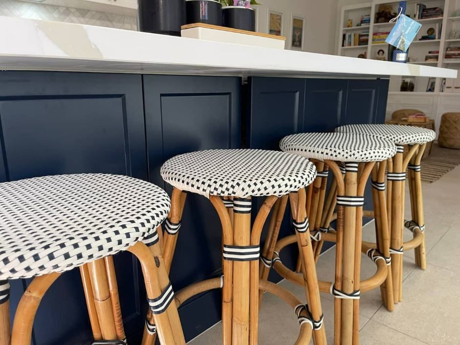 A Row Of Wicker Bar Stools In A Kitchen — Nyblad Construction in Caloundra West, QLD