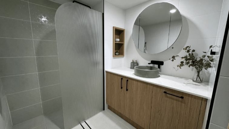 A Bathroom Featuring A Sink And A Mirror Side View — Nyblad Construction in Caloundra West, QLD