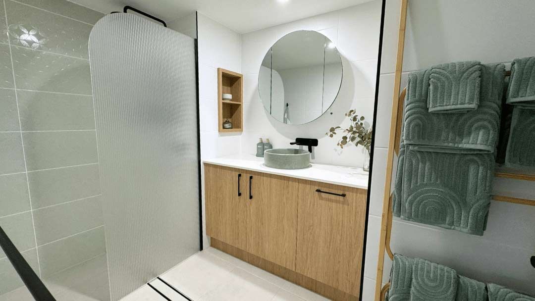 A Bathroom Featuring A Sink And A Mirror — Nyblad Construction in Caloundra West, QLD