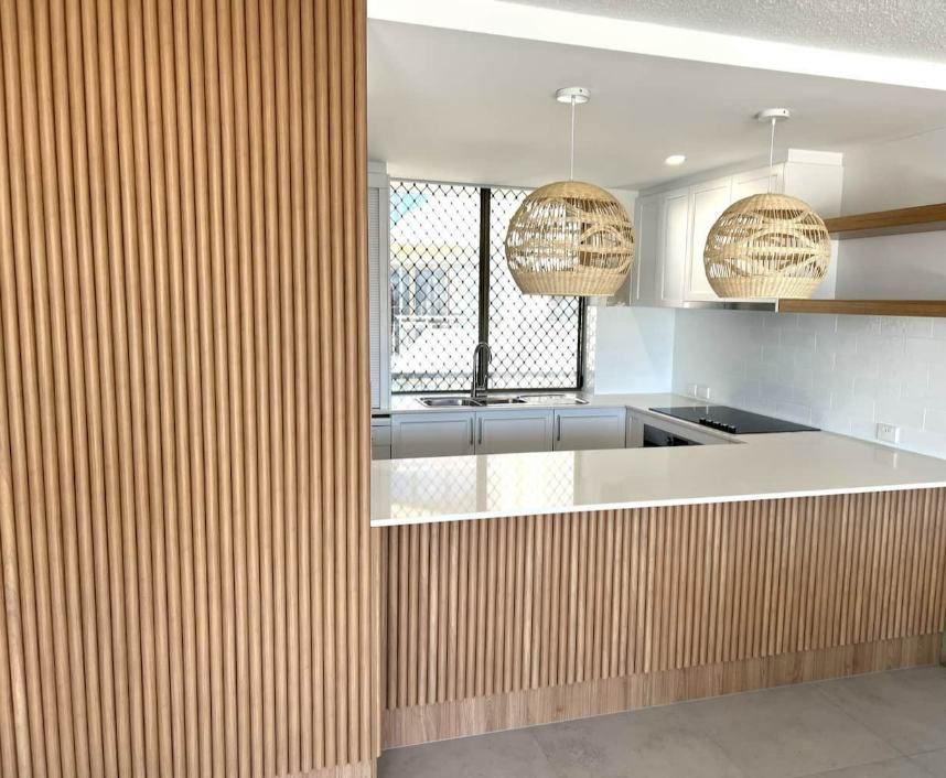  Kitchen With A Wooden Wall And A Counter Top — Nyblad Construction in Caloundra West, QLD