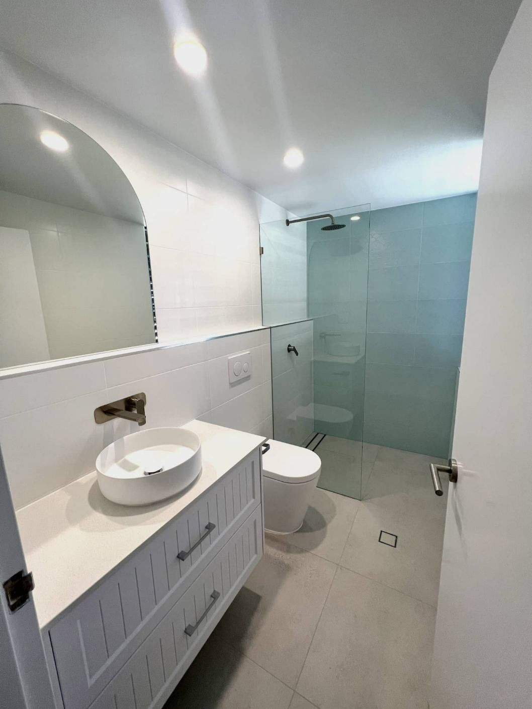 Bathroom With Single Sink Vanity Ans Shower Area — Nyblad Construction in Caloundra West, QLD