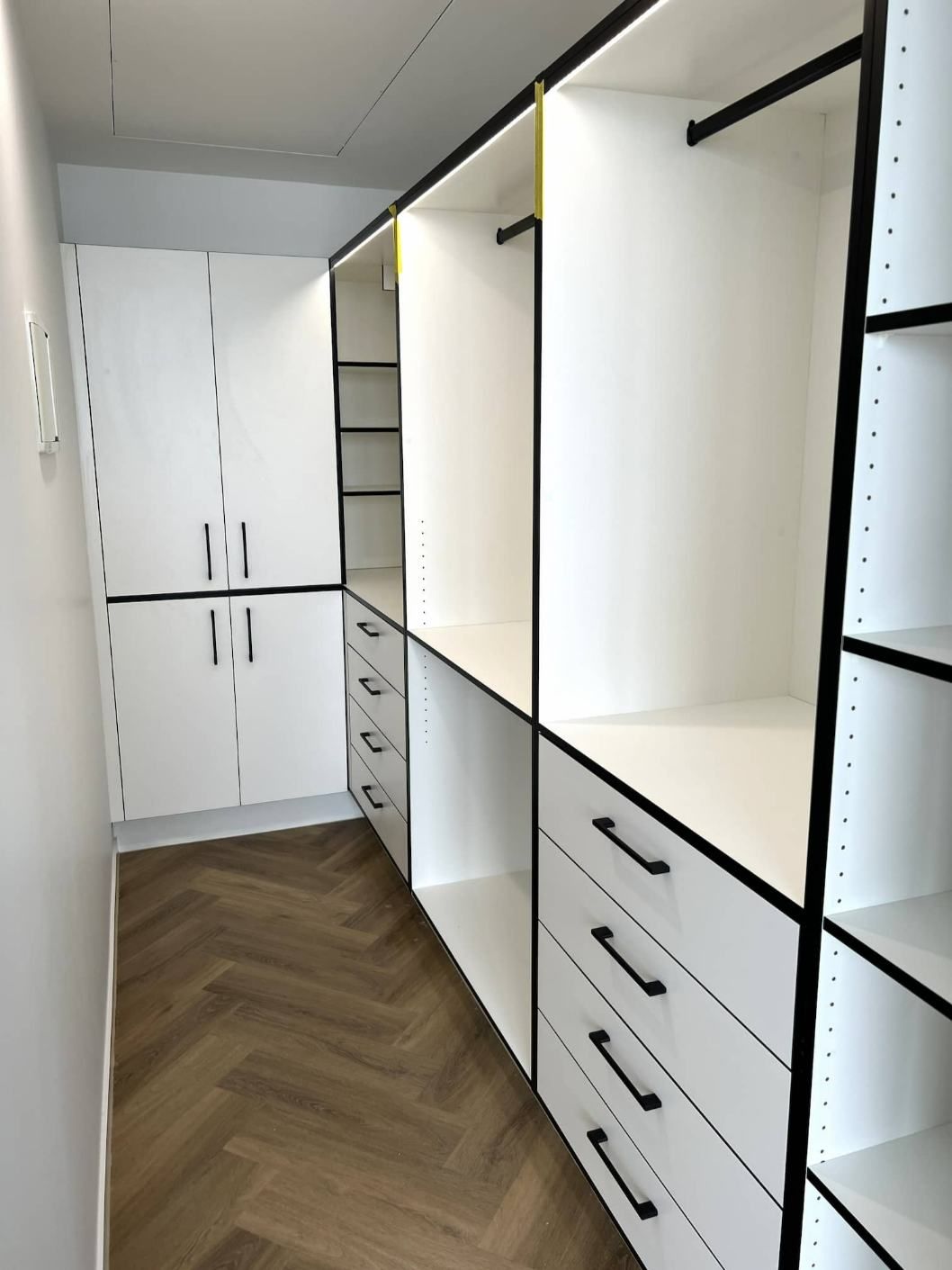 A Walk In Closet With Lots Of Shelves And Drawers — Nyblad Construction in Caloundra West, QLD