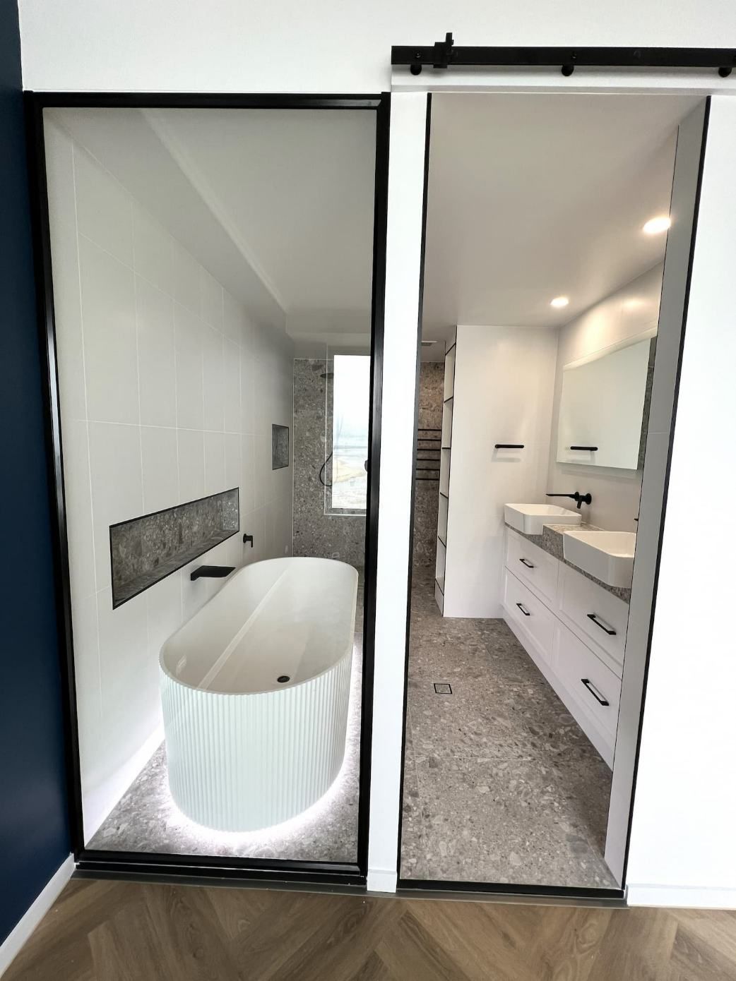 A Spacious Bathroom With A Bathtub And Two Sinks — Nyblad Construction in Caloundra West, QLD
