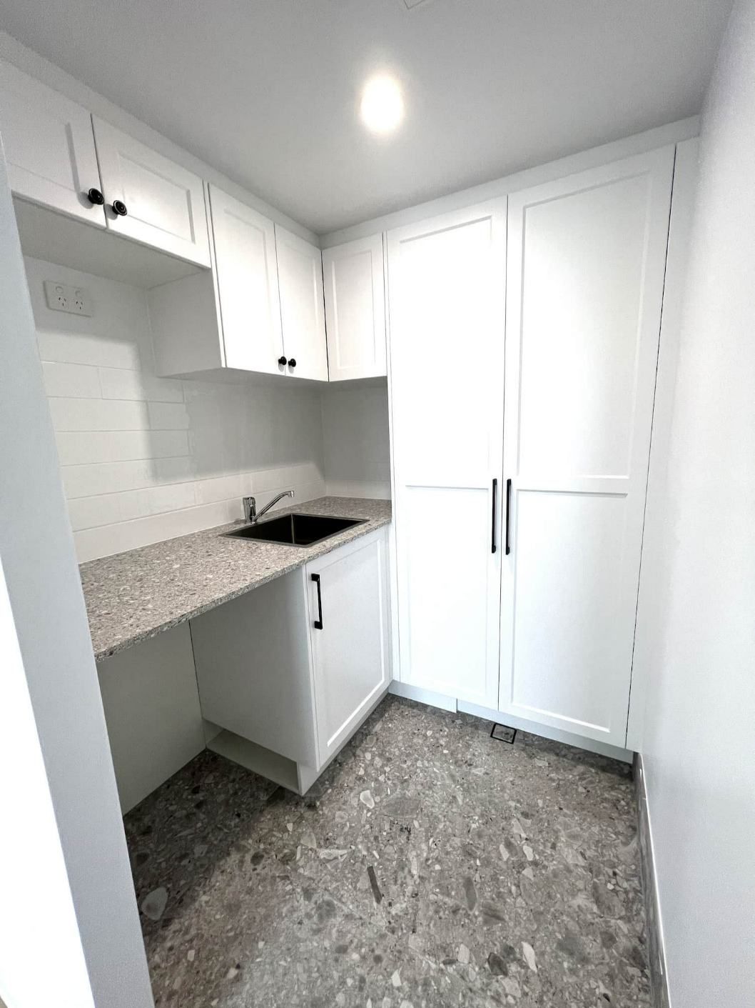 A Kitchen With Granite Counter Tops — Nyblad Construction in Caloundra West, QLD