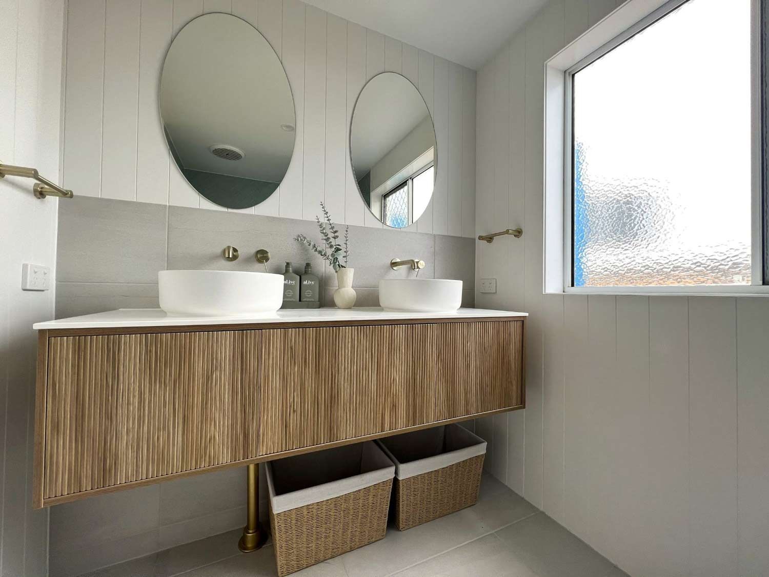 A Bathroom With Two Vanity Sinks And Two Mirrors — Nyblad Construction in Caloundra West, QLD