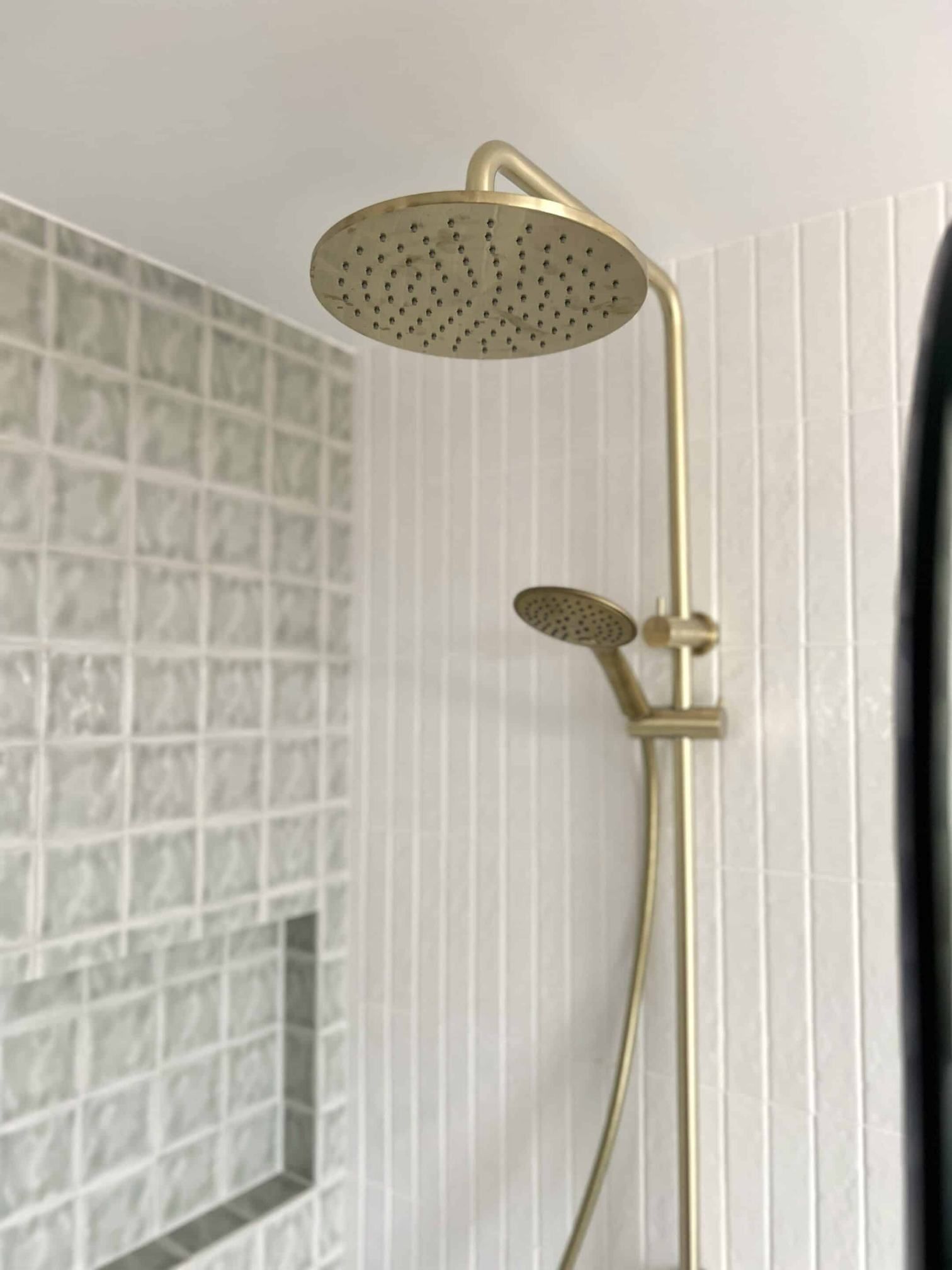 A Golden Shower Head Is Hanging From The Ceiling In A Bathroom — Nyblad Construction in Caloundra West, QLD