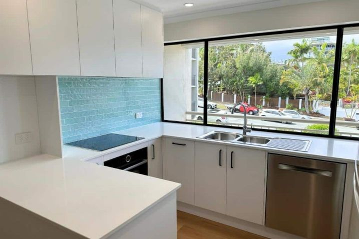 A Kitchen With White Cabinets — Nyblad Construction in Caloundra West, QLD