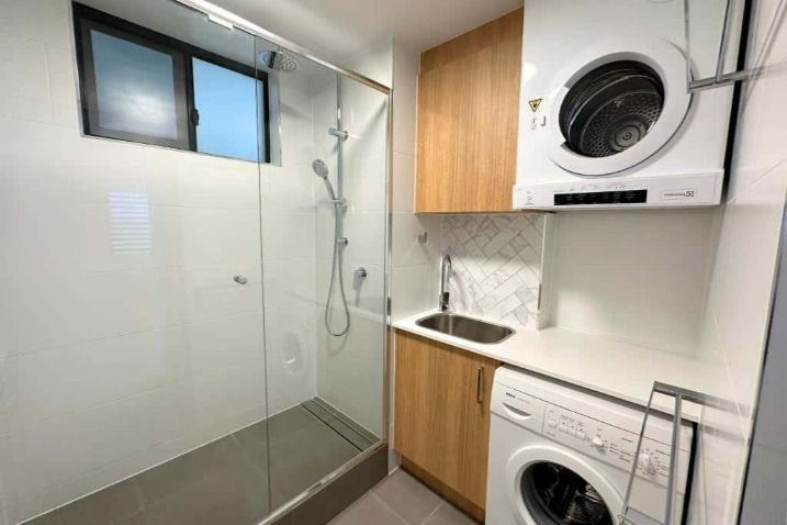 A Laundry Room Two With A Washing Machine — Nyblad Construction in Caloundra West, QLD