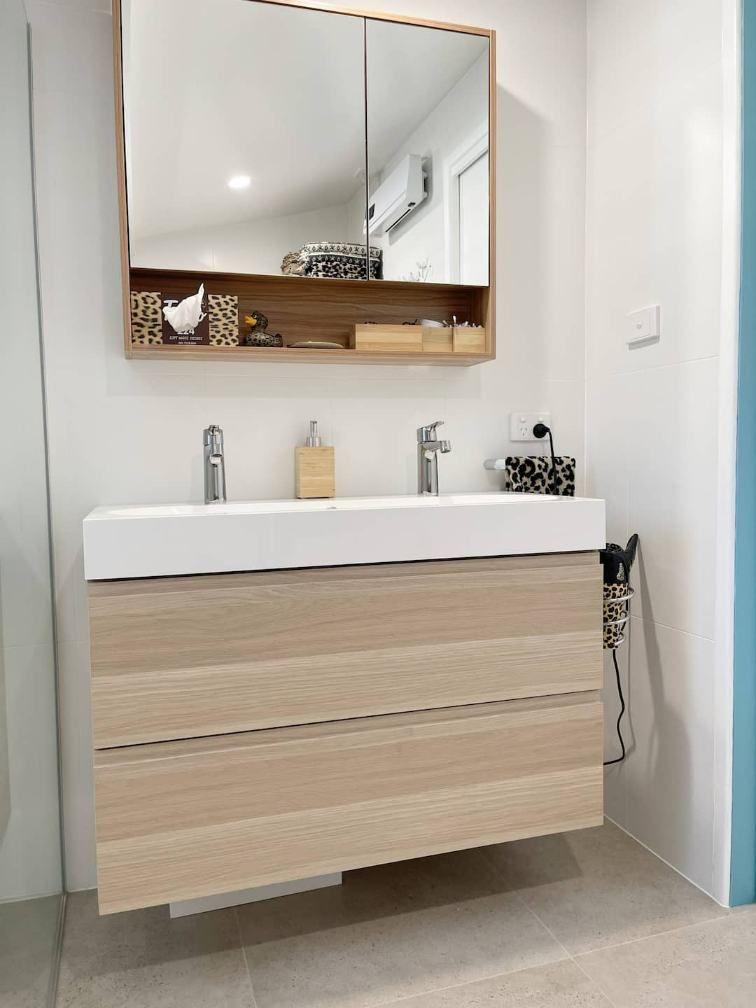 A Bathroom With Drawer And Square Mirror — Nyblad Construction in Caloundra West, QLD