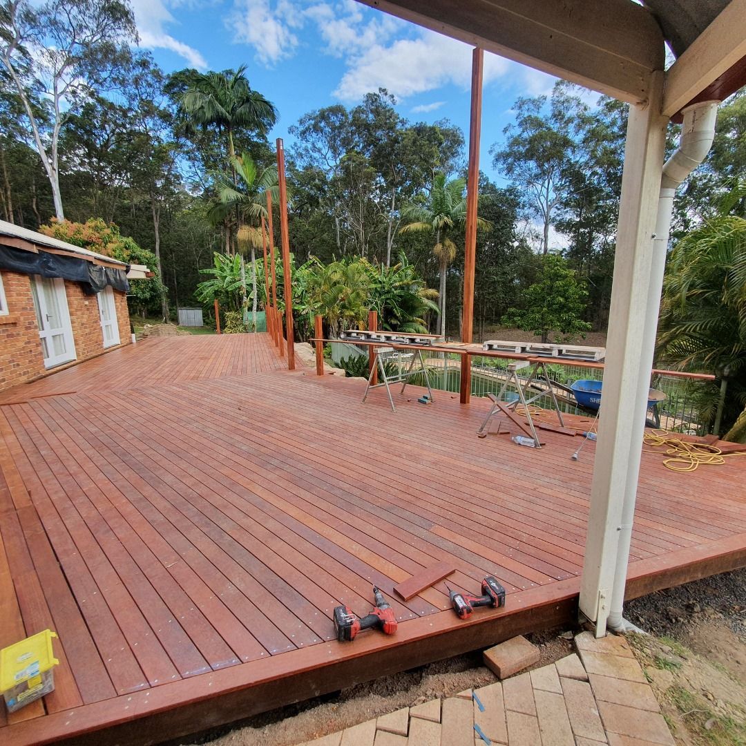 Newly Built Wooden Deck With Tools, Trees in the Background — Nyblad Construction in Caloundra West, QLD