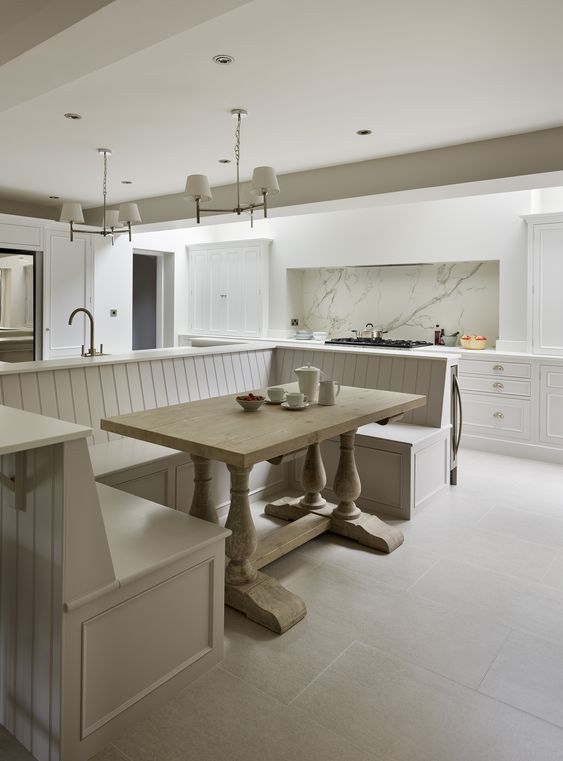 A Kitchen With A Table And Benches In It — Nyblad Construction in Caloundra West, QLD