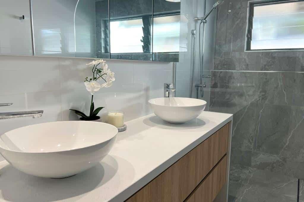 Bathroom With Two Sinks and a Walk in Shower — Nyblad Construction in Caloundra West, QLD