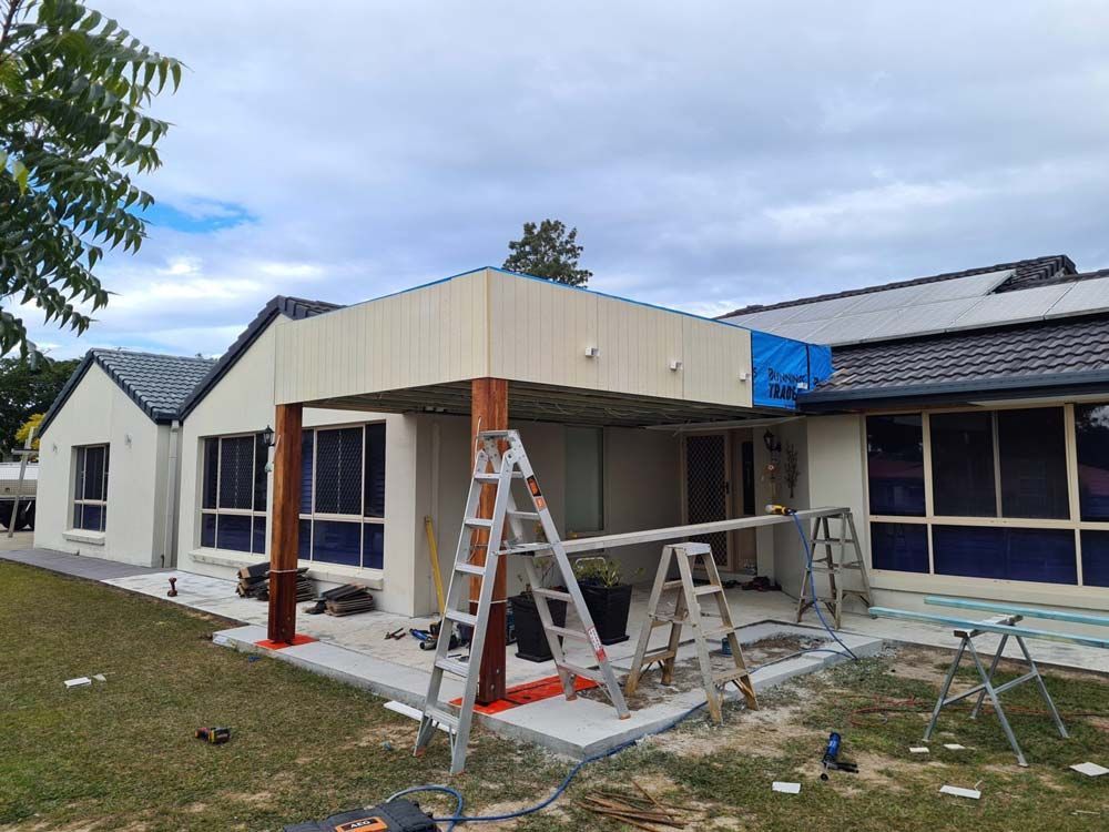 A House Is Being Remodeled And A Ladder Is Sitting In Front Of It — Nyblad Construction in Caloundra West, QLD