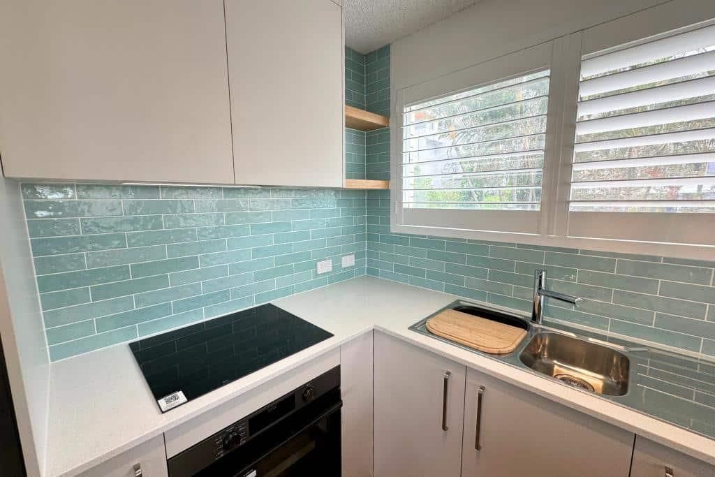 Kitchen With a Stove Top Oven — Nyblad Construction in Caloundra West, QLD