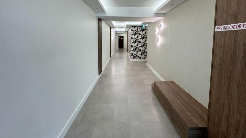Long Hallway With a Wooden Bench in the Middle — Nyblad Construction in Caloundra West, QLD