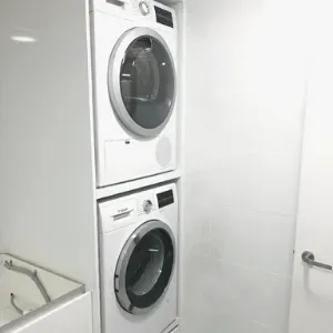 Functional Stacked Washing Machine And Dryer Combo With Storage Drawer — Nyblad Construction in Caloundra West, QLD